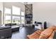 Spacious living room features a stone fireplace and large windows offering plenty of natural light at 4255 Kettering Dr, Zionsville, IN 46077