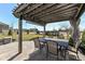 Covered patio featuring an outdoor dining set, providing a comfortable space for outdoor meals at 4255 Kettering Dr, Zionsville, IN 46077