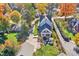 Beautiful aerial shot of the home with a backyard patio in a neighborhood surrounded by fall foliage at 450 W Ash St, Zionsville, IN 46077