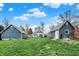 Large backyard with a spacious lawn, a shed, an additional outbuilding and room for outdoor activities at 450 W Ash St, Zionsville, IN 46077