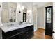 Elegant bathroom featuring a dual-sink vanity with marble countertop and modern lighting at 450 W Ash St, Zionsville, IN 46077