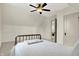 Bright bedroom with a vintage bed frame, an adjoining doorway, and a ceiling fan at 450 W Ash St, Zionsville, IN 46077
