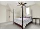 Bright bedroom with modern bed, ceiling fan, and natural light at 450 W Ash St, Zionsville, IN 46077