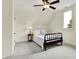 Cozy bedroom with a wrought iron bed frame, vintage end table, and plenty of natural light at 450 W Ash St, Zionsville, IN 46077