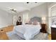 Bright bedroom with hardwood floors, large windows with shutters, and ceiling fan at 450 W Ash St, Zionsville, IN 46077
