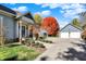 Charming home exterior with a well-manicured lawn and a detached garage at 450 W Ash St, Zionsville, IN 46077