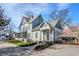 Charming two-story home with mature trees and landscaped yard at 450 W Ash St, Zionsville, IN 46077