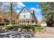 Charming two-story home featuring a classic wrap-around porch and well-maintained landscaping at 450 W Ash St, Zionsville, IN 46077