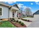 Charming home exterior with a well-manicured lawn and a side entrance at 450 W Ash St, Zionsville, IN 46077