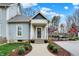 Charming home features a welcoming front entrance with lovely landscaping and a well-maintained walkway at 450 W Ash St, Zionsville, IN 46077