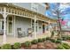 Charming front porch with rocking chairs and well-maintained landscaping, offering a relaxing outdoor space at 450 W Ash St, Zionsville, IN 46077