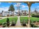 Charming street view seen from the front porch, with potted flowers flanking the walkway at 450 W Ash St, Zionsville, IN 46077