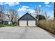 Spacious two-car garage with ample parking space on a large paved driveway at 450 W Ash St, Zionsville, IN 46077