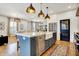 Spacious kitchen featuring a large island, stainless steel appliances, and open layout at 450 W Ash St, Zionsville, IN 46077