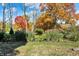 Beautiful landscaping featuring ornamental grasses, flowering bushes, and colorful autumn foliage at 450 W Ash St, Zionsville, IN 46077
