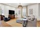 Cozy living room with hardwood floors, neutral color palette, and a television at 450 W Ash St, Zionsville, IN 46077