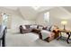 Bright living room with sectional sofa, hardwood table, and great natural light at 450 W Ash St, Zionsville, IN 46077