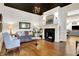 Bright living room featuring hardwood floors, fireplace, and natural light, creating a warm atmosphere at 450 W Ash St, Zionsville, IN 46077