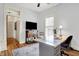 A well-lit office features hardwood floors, built-in shelves, modern desk, and decor at 450 W Ash St, Zionsville, IN 46077