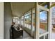 Inviting screened-in porch offering a tranquil space to enjoy the outdoors with comfortable seating at 450 W Ash St, Zionsville, IN 46077