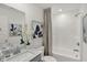 Modern bathroom with a vanity, a toilet, a shower and tub, and stylish decorative accents at 4571 Laughter Ln, Indianapolis, IN 46235