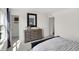 Bright bedroom with a stylish dresser, mirror, and closet, offering ample storage and natural light at 4571 Laughter Ln, Indianapolis, IN 46235
