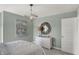 Bright bedroom features a modern light fixture and cozy ambiance with plenty of natural light at 4571 Laughter Ln, Indianapolis, IN 46235