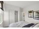 Bedroom with a closet and window featuring a barn and trees at 4571 Laughter Ln, Indianapolis, IN 46235