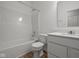 This bathroom includes a shower-tub combo, white vanity, and neutral flooring at 5138 Modernist Blvd, Indianapolis, IN 46237