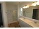 Bathroom with double sink vanity, large mirror, and glass-enclosed shower at 5138 Modernist Blvd, Indianapolis, IN 46237