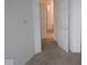 Bedroom boasts neutral carpet and trim, with an open door leading to another room at 5138 Modernist Blvd, Indianapolis, IN 46237