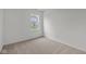 Bedroom featuring neutral walls, carpet and a window overlooking the backyard at 5138 Modernist Blvd, Indianapolis, IN 46237