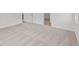 Bedroom with neutral carpet, white walls, and baseboards, featuring doorway and light streaming in from window at 5138 Modernist Blvd, Indianapolis, IN 46237
