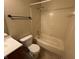 Bathroom with a tiled shower-tub combination, a toilet, and vanity at 5730 Pemberly Dr, Indianapolis, IN 46221