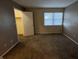 Neutral bedroom featuring cozy carpet and view of the closet at 5730 Pemberly Dr, Indianapolis, IN 46221
