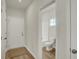 Entryway view showing door to bathroom with toilet and tub at 5777 Greenbrier Ct, Brownsburg, IN 46112
