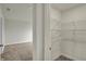Bright closet with wire shelving and neutral walls, located off of a carpeted room at 5777 Greenbrier Ct, Brownsburg, IN 46112