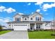 Charming two-story home with gray siding, black shutters, and a well-manicured lawn at 5777 Greenbrier Ct, Brownsburg, IN 46112