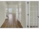 Spacious hallway with hardwood floors leading to the staircase and main living areas at 5777 Greenbrier Ct, Brownsburg, IN 46112