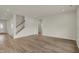 Open-concept living area with hardwood floors, ample space, and natural light at 5777 Greenbrier Ct, Brownsburg, IN 46112
