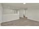 Bright and airy loft area with neutral walls, carpeting, and well-placed lighting at 5777 Greenbrier Ct, Brownsburg, IN 46112