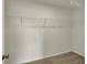 An empty walk-in closet features wire shelving and carpeted floor at 5777 Greenbrier Ct, Brownsburg, IN 46112