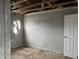 View of damaged bedroom with missing ceiling and wall damage, requiring extensive repairs at 6009 Tammin Dr, Indianapolis, IN 46254