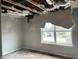 View of damaged bedroom with missing ceiling, water damage, and exposed framing at 6009 Tammin Dr, Indianapolis, IN 46254