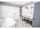 Modern bathroom features a soaking tub, dual vanities, and stylish tile flooring at 615 E Morris St, Indianapolis, IN 46203