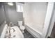 Bright bathroom showcasing a modern soaking tub, updated vanity, and clean white finishes at 615 E Morris St, Indianapolis, IN 46203