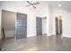 Spacious bedroom with large windows, a ceiling fan, and gray hardwood floors at 615 E Morris St, Indianapolis, IN 46203