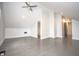 Spacious bedroom has vaulted ceilings, ceiling fan, gray wood floors, and open doorway at 615 E Morris St, Indianapolis, IN 46203