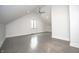 Spacious bedroom with vaulted ceilings, gray wood floors and large window at 615 E Morris St, Indianapolis, IN 46203