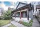 Charming home featuring a welcoming front porch and nicely landscaped yard at 615 E Morris St, Indianapolis, IN 46203